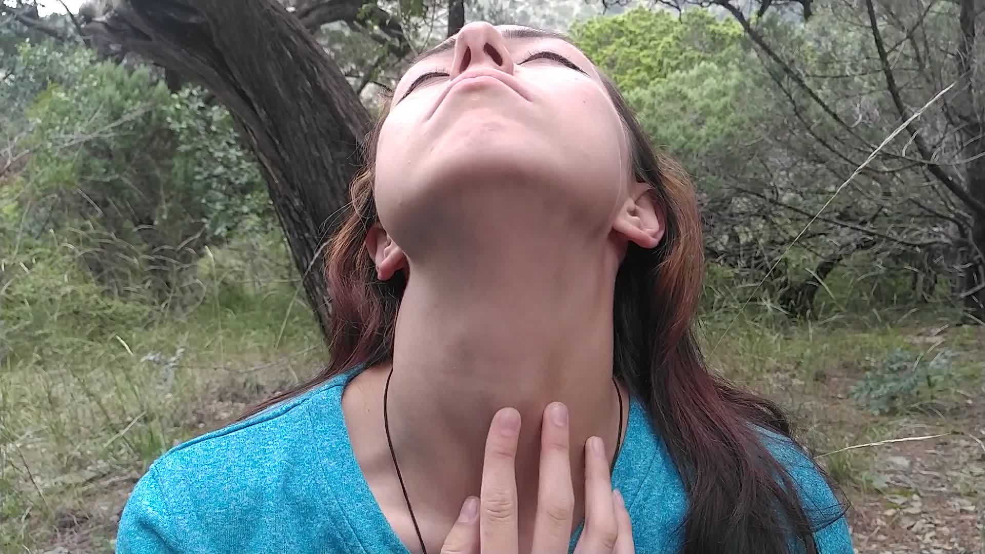 A woman's throat vein visibly throbbing