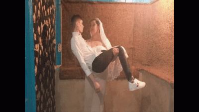 The Bride Picks Up And Carries The Groom