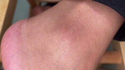 Ebony Feet Playing On A Stool